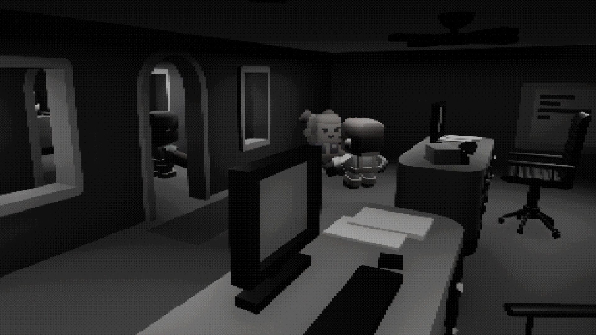 A grey open plan office at night, desks lit only by monitors.